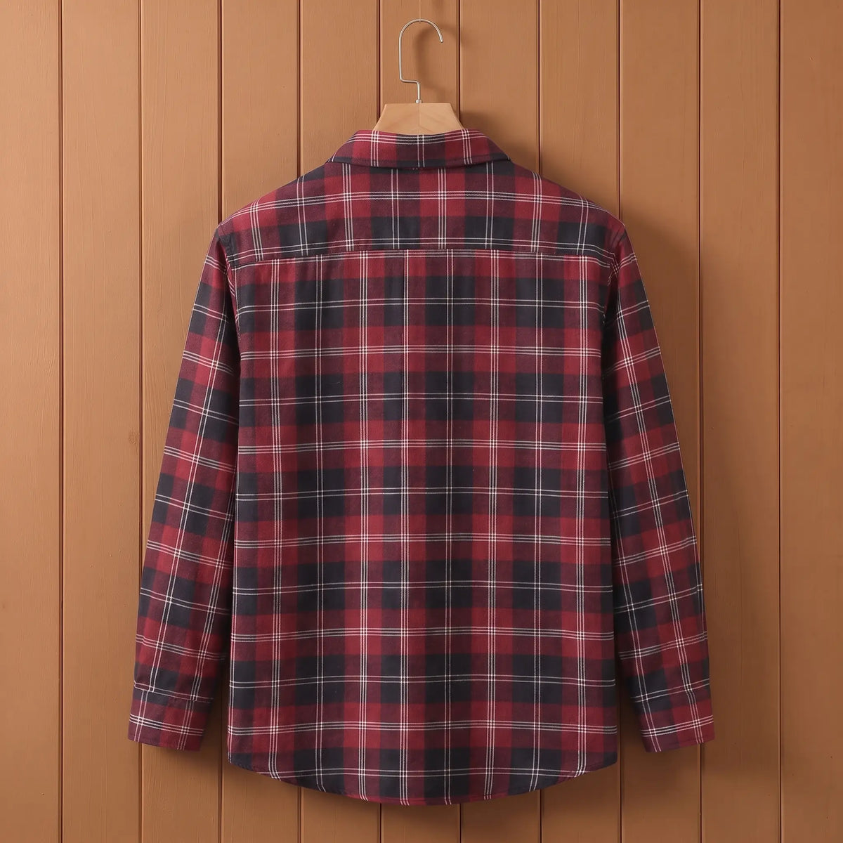 Back view of red plaid long-sleeve shirt on a wooden hanger
