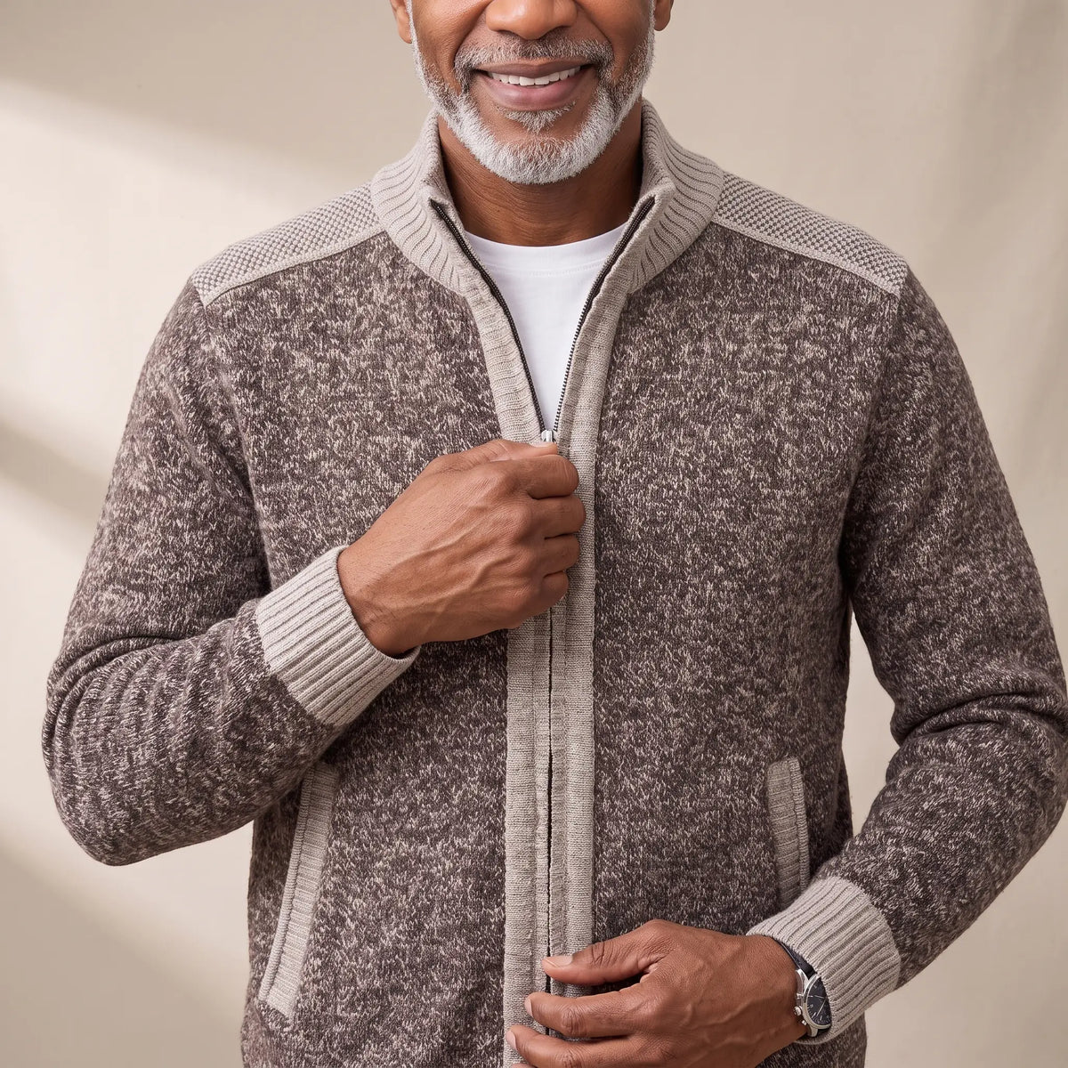 Man zipping up the MARL ZIP CARDIGAN in coffee
