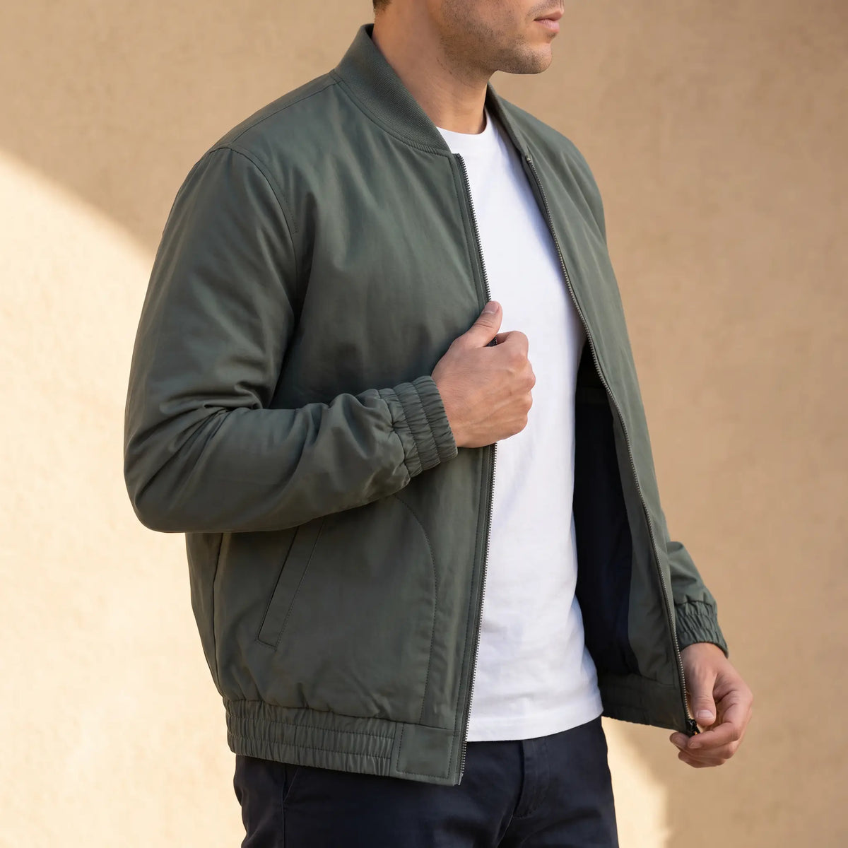 Relaxed Fit Bomber in Green worn over a white tee