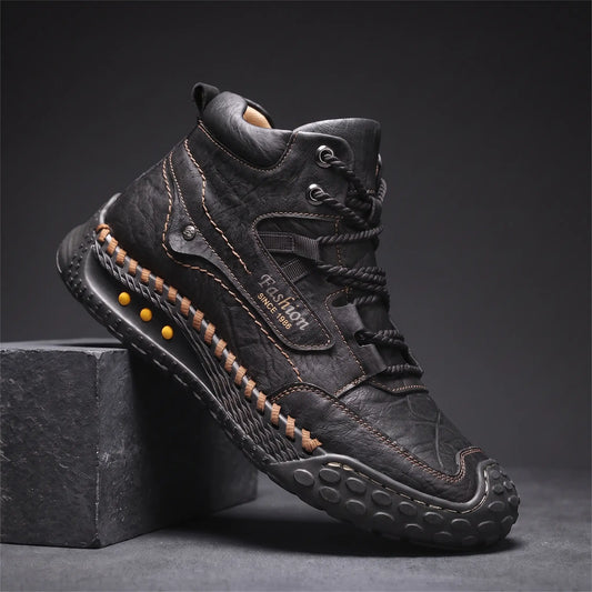 STUDDED SOLE BOOTS in black, men's mid-high lace-up boot in washed creased leather with hand-stitched sole edge and studded rubber outsole