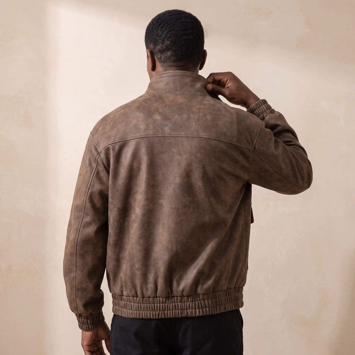 Back view of a man wearing the coffee stand collar jacket