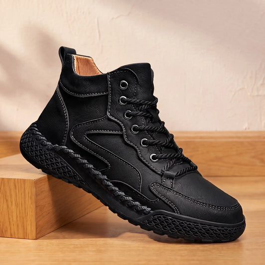 WAVE PANEL BOOTS in black, men's high-top lace-up boot with wave-stitched side panels and braided hand stitching around the sole