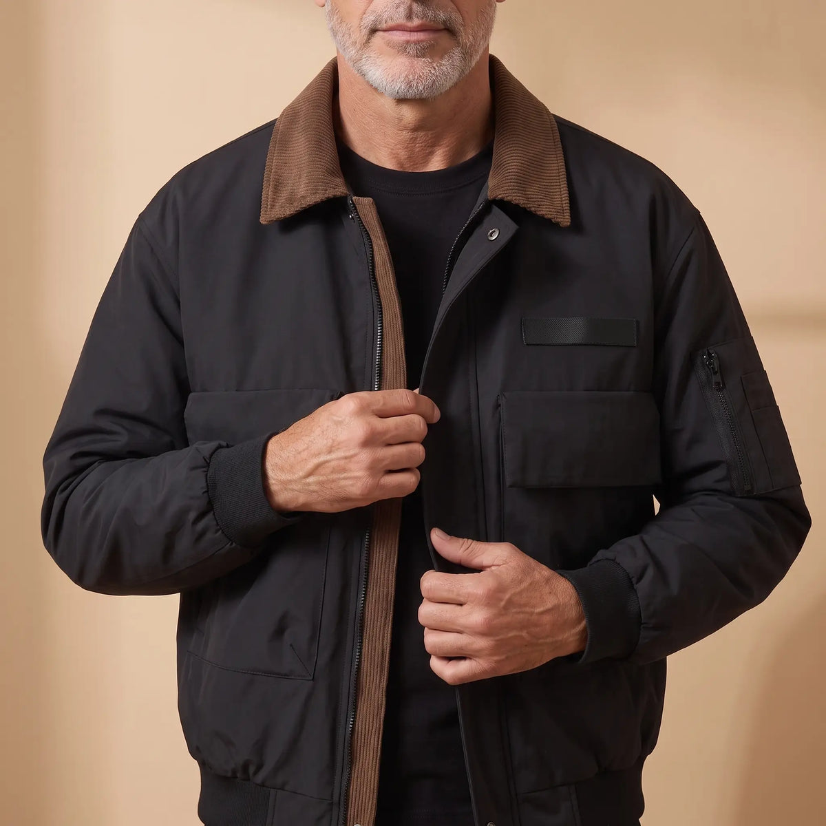 Man fastening the snaps on the WEEKEND WORK JACKET in black