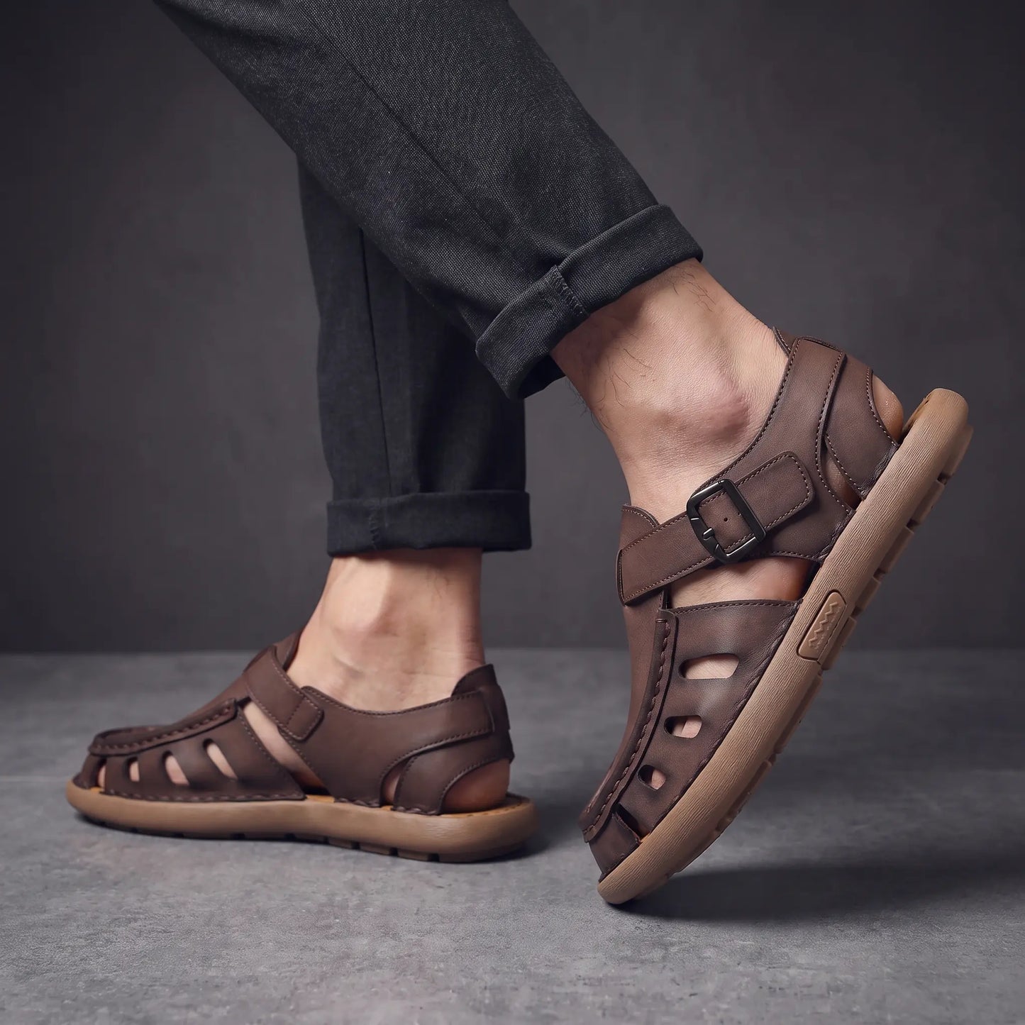 Man wearing the pair of brown Roman sandals