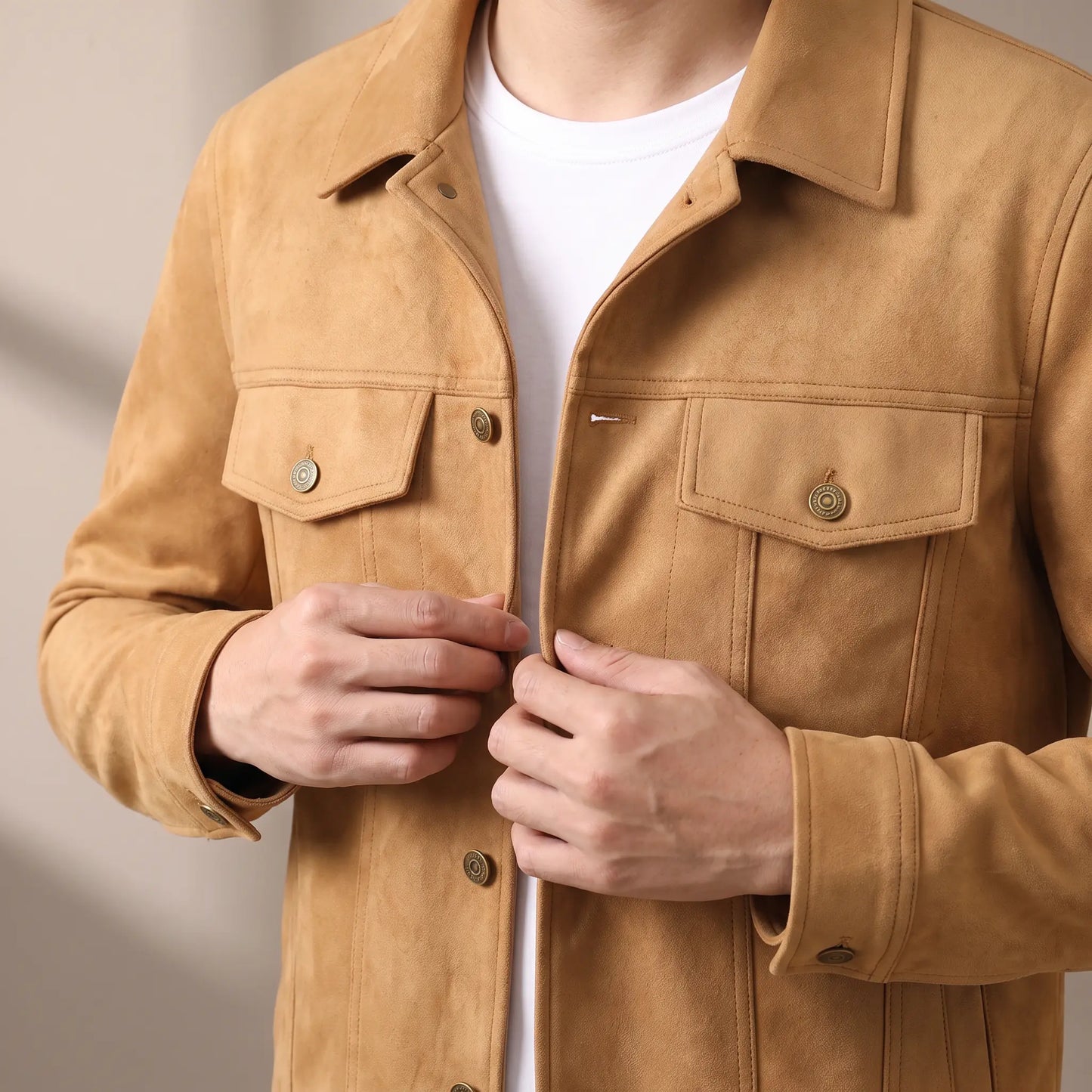 Man fastening the khaki suede jacket