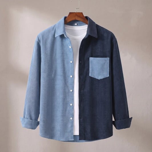Two Tone Overshirt in blue and navy, a two tone colour blocked corduroy overshirt with a patch chest pocket on a wooden hanger