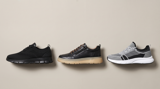 Three Adam and Westcott men's sneakers lined up on a warm neutral background