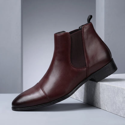SMOOTH GENTLEMAN BOOTS maroon burgundy Chelsea boot on a grey stone plinth in a cool grey studio