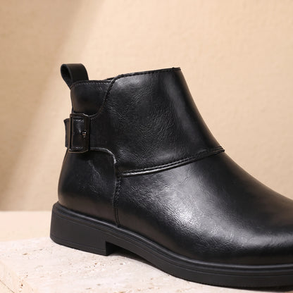 Close-up of black Chelsea boot upper and side panel