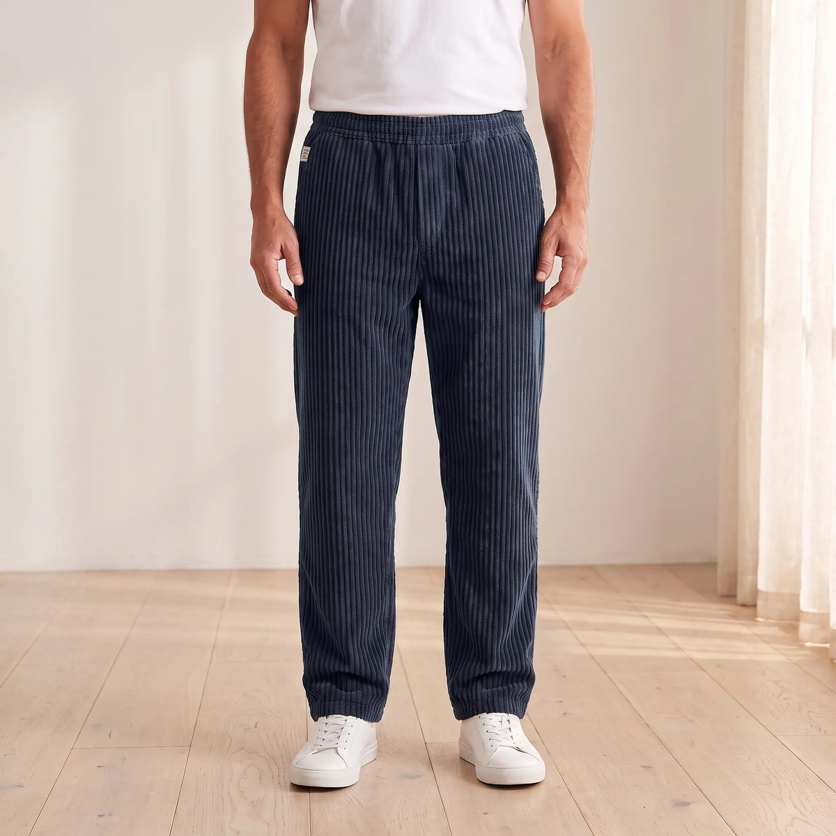 Men's navy blue wide wale corduroy loose straight trousers with elastic waist, worn