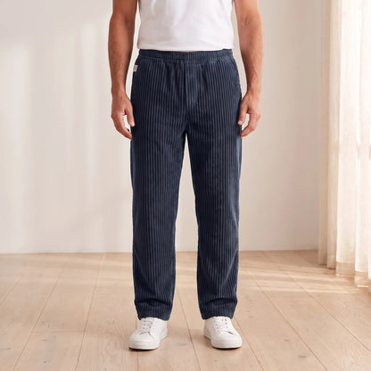 Men's navy blue wide wale corduroy loose straight trousers with elastic waist, worn