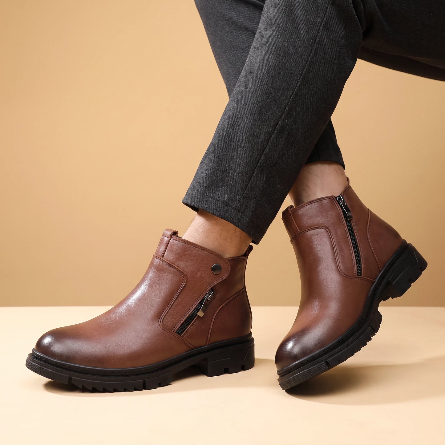 SHARP ZIP ANKLE BOOTS worn by a man in dark trousers, crossed-ankles view
