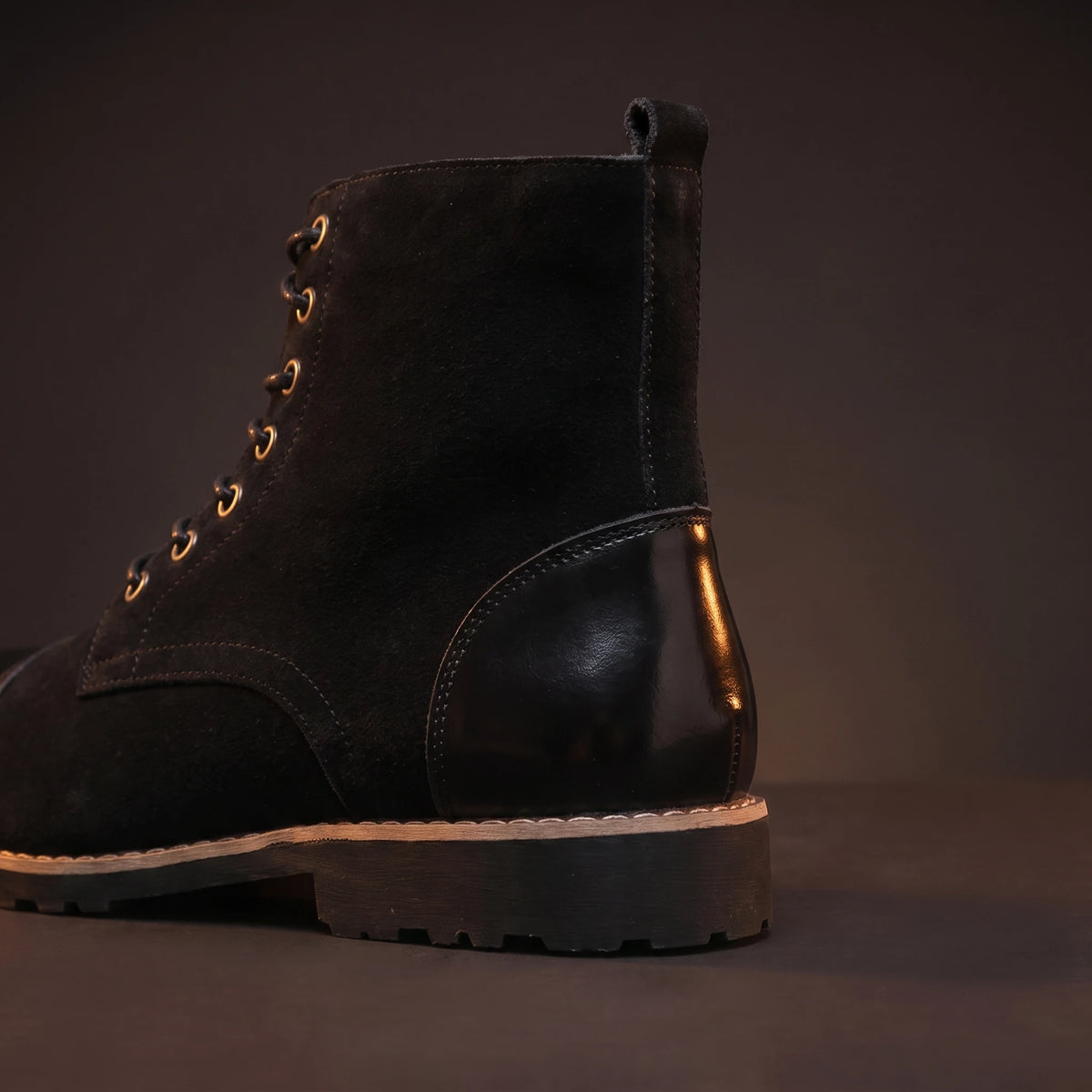 Close-up of black leather boot heel and back detail