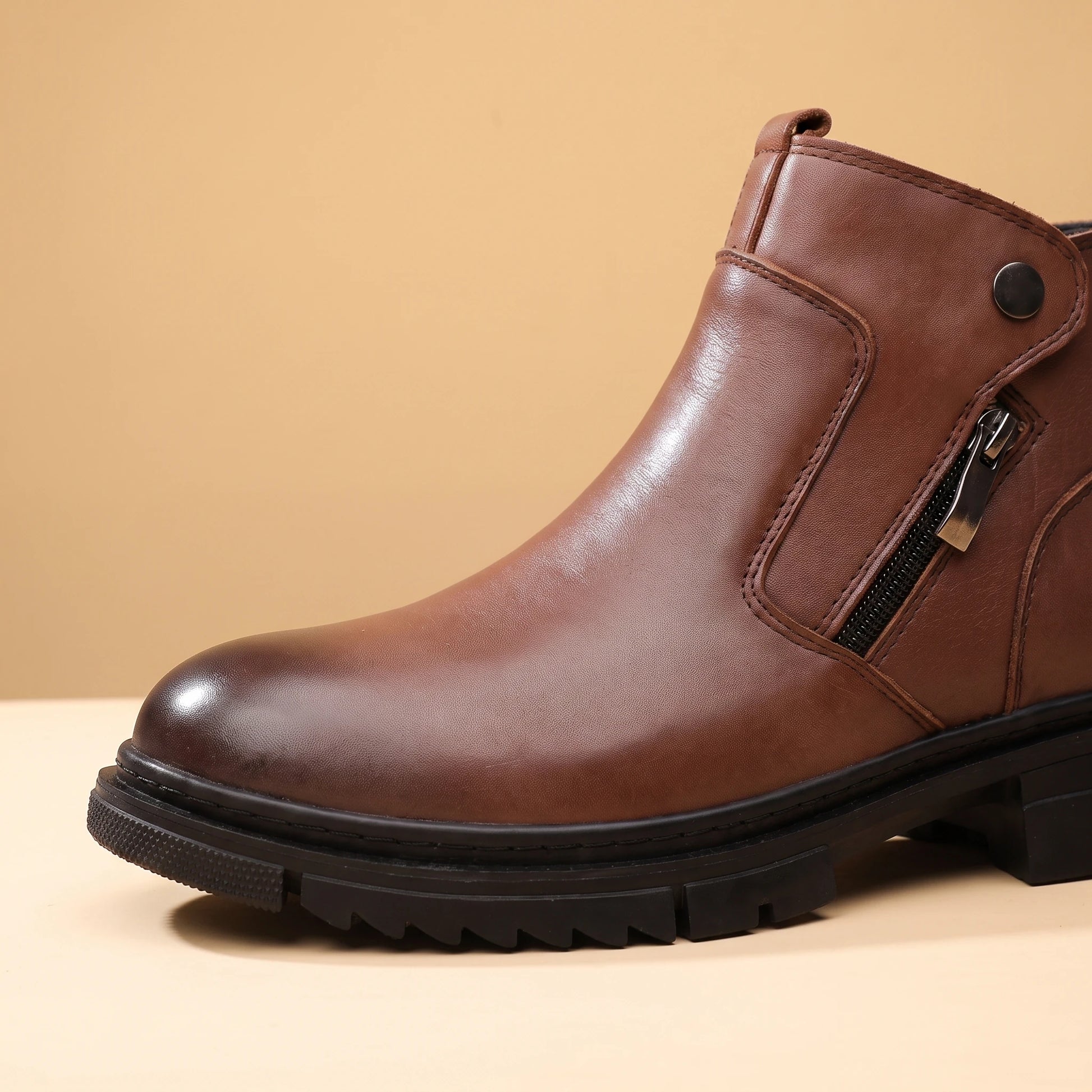 SHARP ZIP ANKLE BOOTS close-up detail of the side zip pull and toe