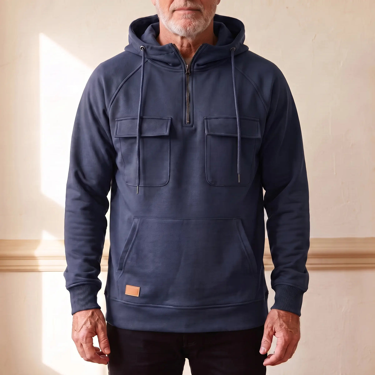 Men's navy blue hooded anorak sweatshirt with half zip and twin chest flap pockets, worn