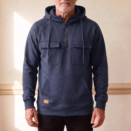 Men's navy blue hooded anorak sweatshirt with half zip and twin chest flap pockets, worn