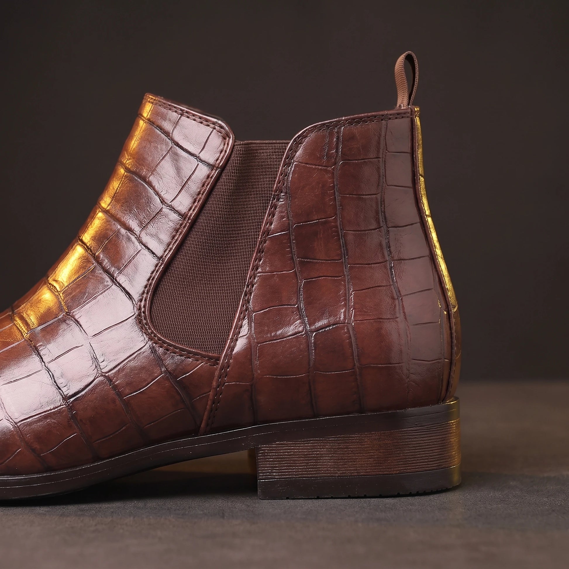 CROC GRAIN BOOTS close-up of the back pull tab, elastic panel and platform heel