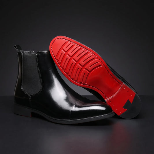 RED SOLE BOOTS black patent Chelsea boot propped toe-up showing the detailed red lugged sole, dark charcoal scene