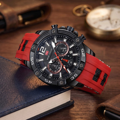 Men's red sport chronograph watch with screw-set black bezel and red silicone strap, resting on leather-bound books