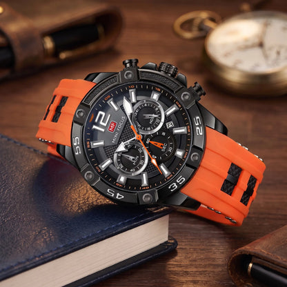 Men's orange sport chronograph watch with screw-set black bezel and orange silicone strap, resting on leather-bound books