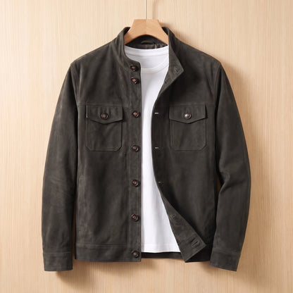 REFINED CHORE JACKET dark grey suede button-front shirt-jacket with two chest flap pockets on a wooden hanger against a light bright wood wall