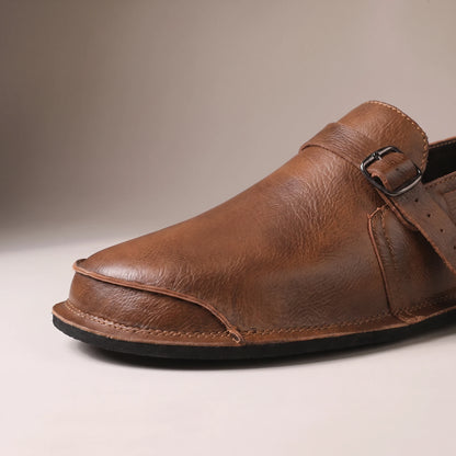 CLASSIC SLIP-ON LOAFERS close-up detail of the vamp strap buckle and rounded toe