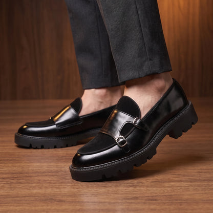 Thick sole loafers worn with dark trousers