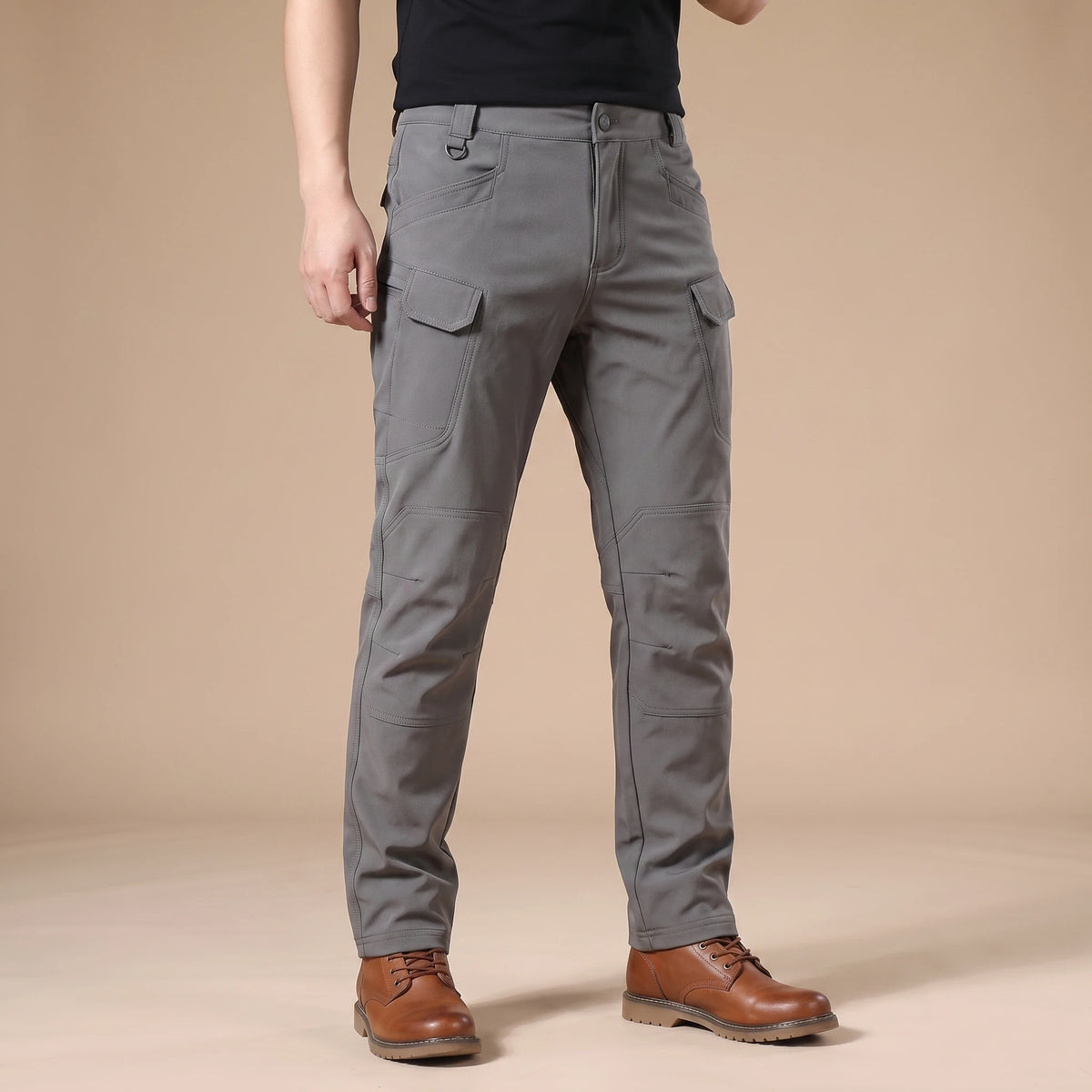 Stretch cargo trousers in gray, worn front view in a warm studio