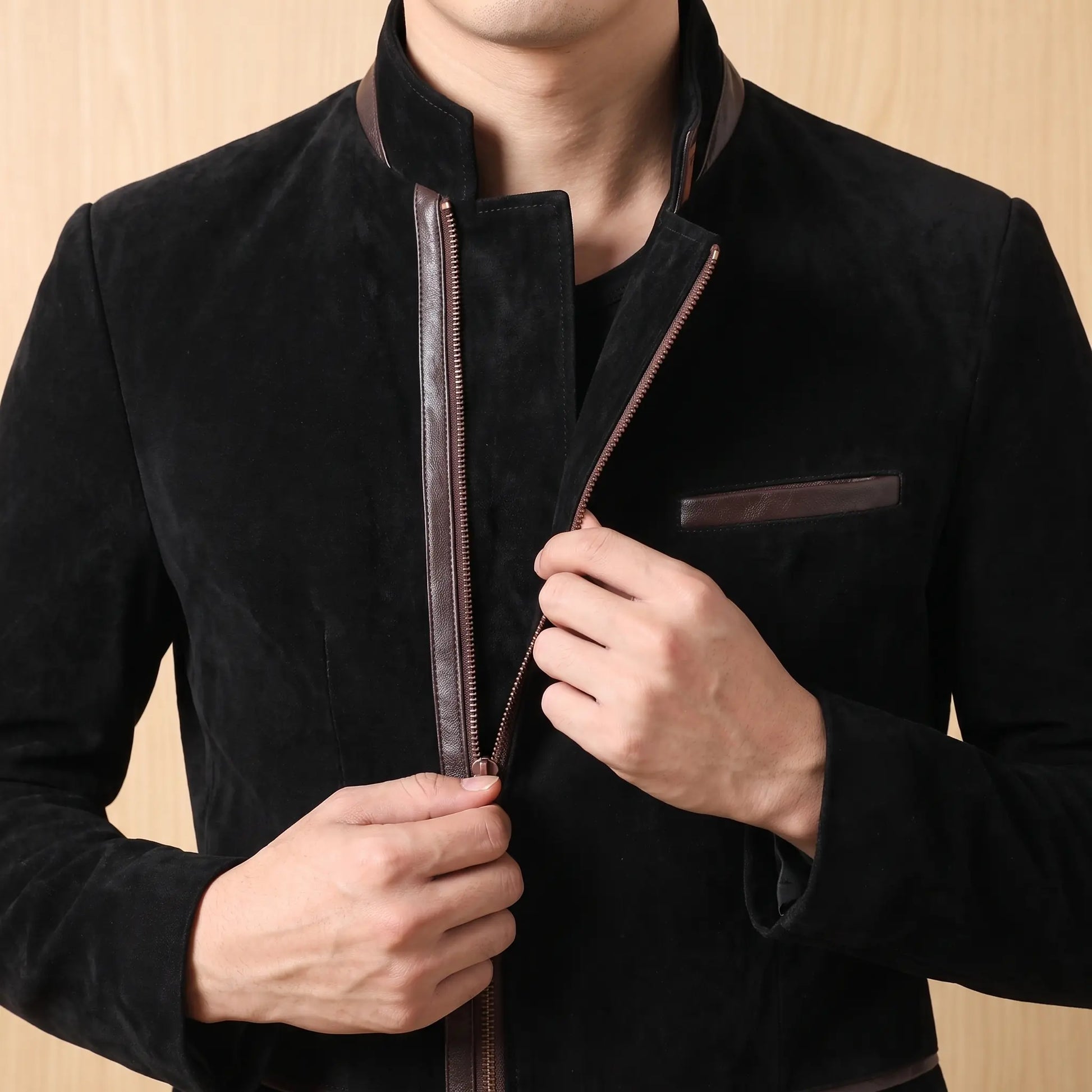 Man wearing black Angled Zip Jacket zipping up the front