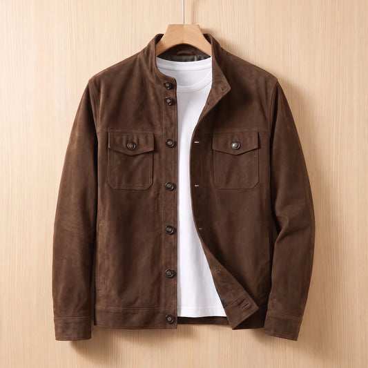 REFINED CHORE JACKET brown suede button-front shirt-jacket with two chest flap pockets on a wooden hanger against a light bright wood wall