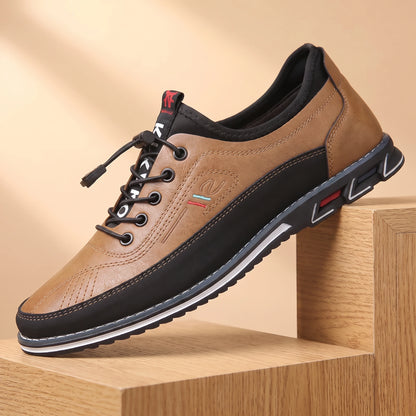 SMART CASUAL SNEAKERS beige-tan casual leather sneaker on a light oak platform, warm daylight