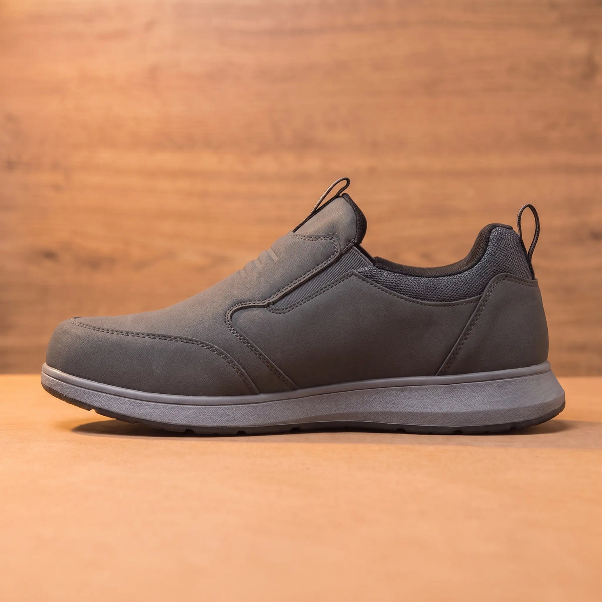Side profile of the grey slip-on loafer