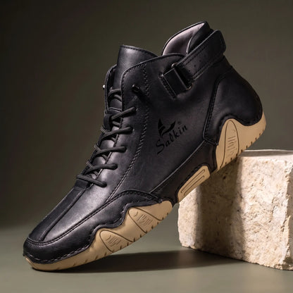 Men's black leather high top ankle boot sneaker with padded collar and cream wave sole