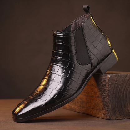 CROC GRAIN BOOTS black croc-texture platform Chelsea boot on a smoked-oak block, moody amber light