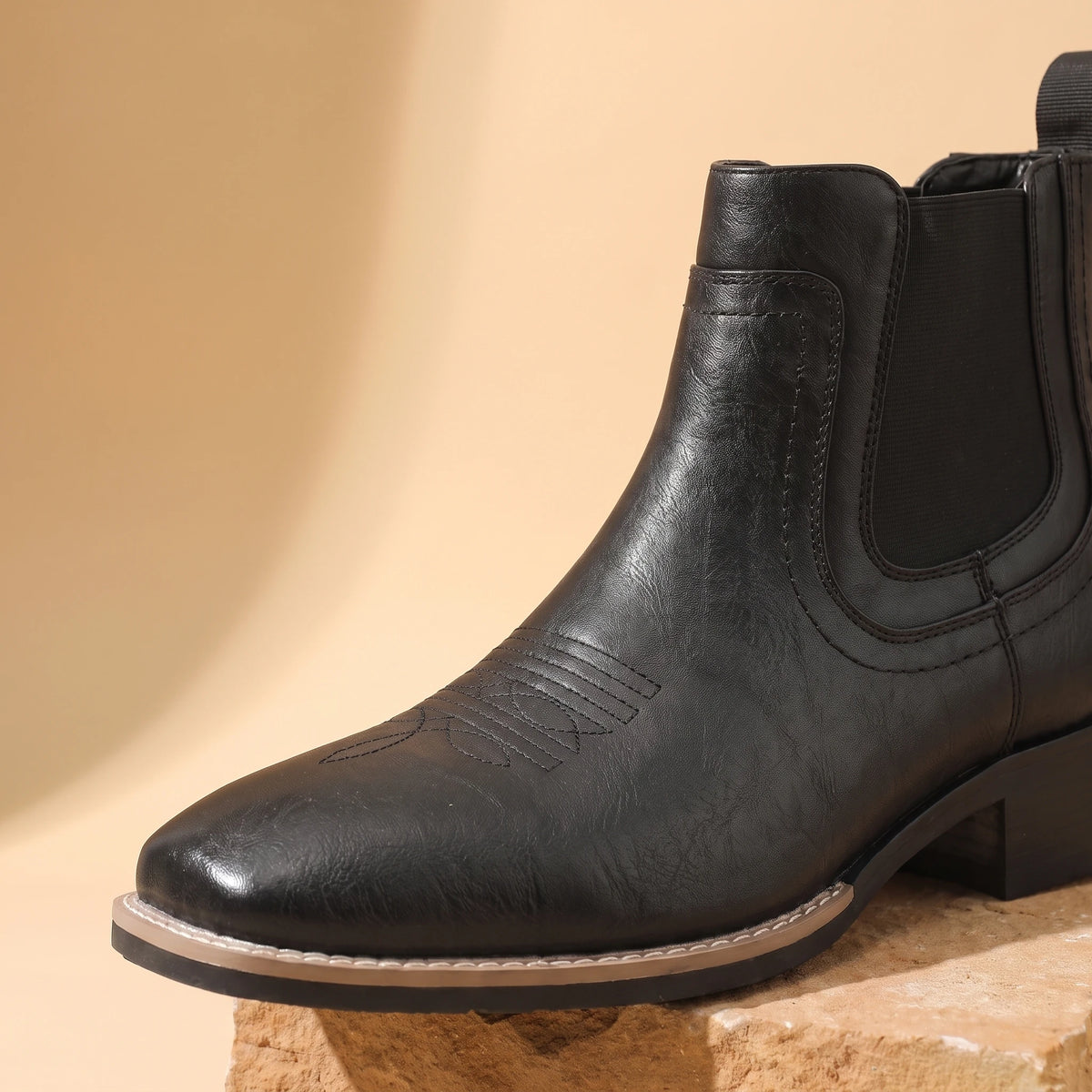 Close-up of black Chelsea boot upper and side gore