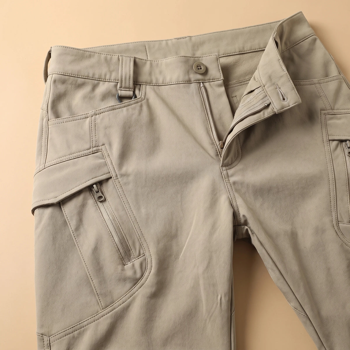 Stretch cargo trousers waistband and cargo pocket detail close-up