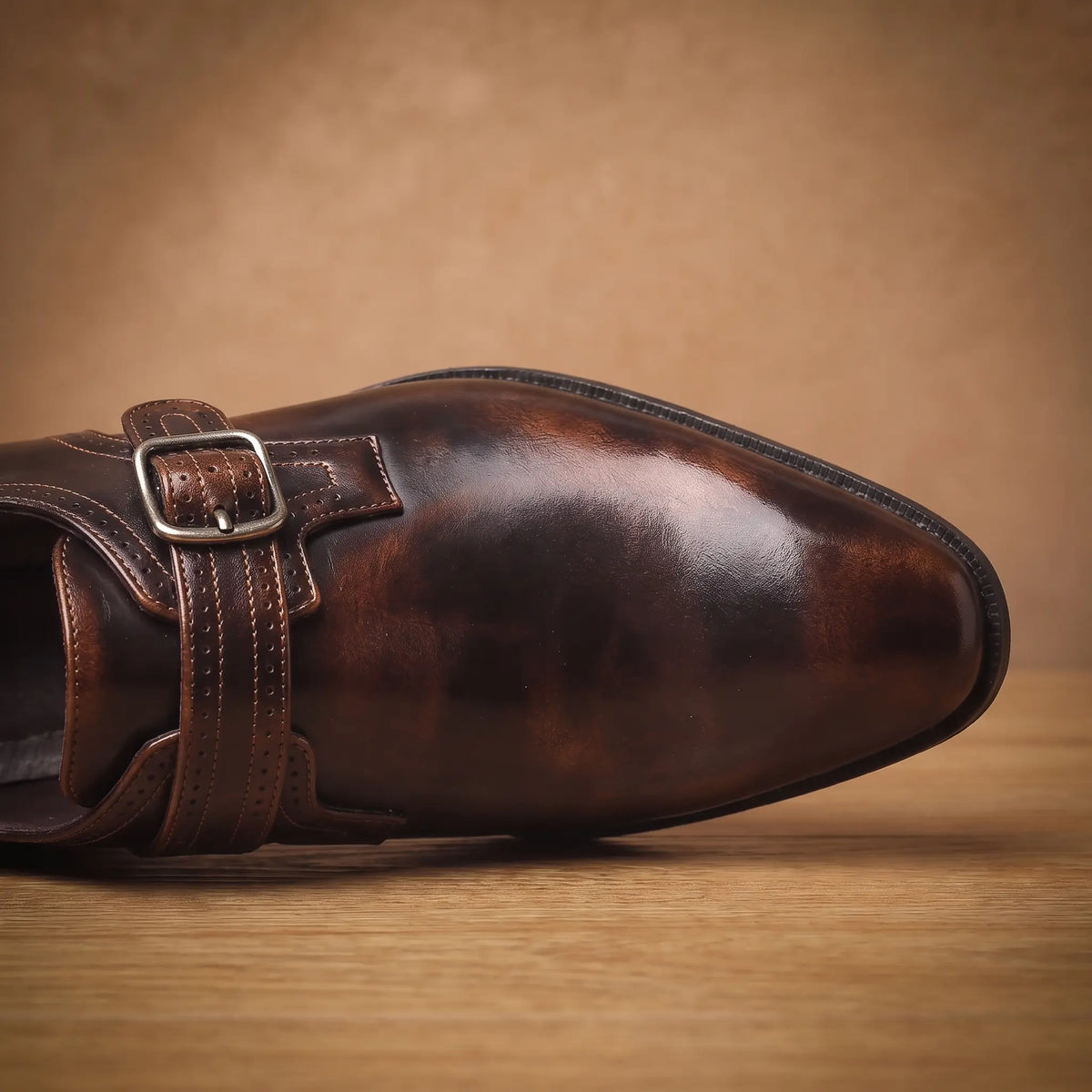 Monk strap shoe toe and buckle detail