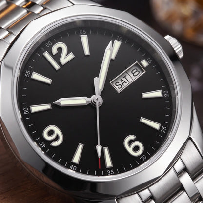APPLIED NUMERAL WATCH dial close-up - applied glowing numerals and twin day-date window on the black dial