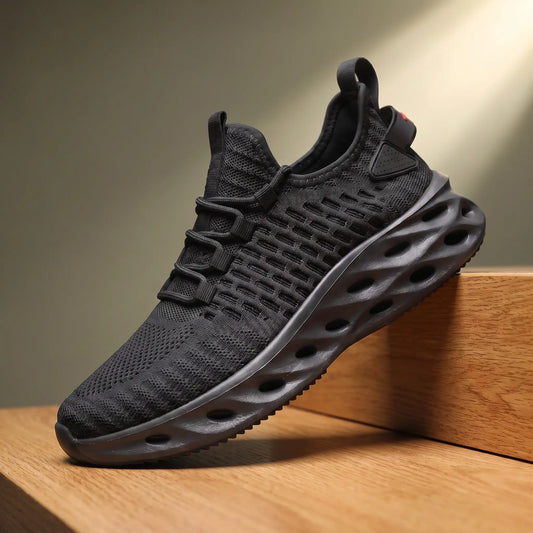 Black knit running sneakers with a thick blade cutout sole