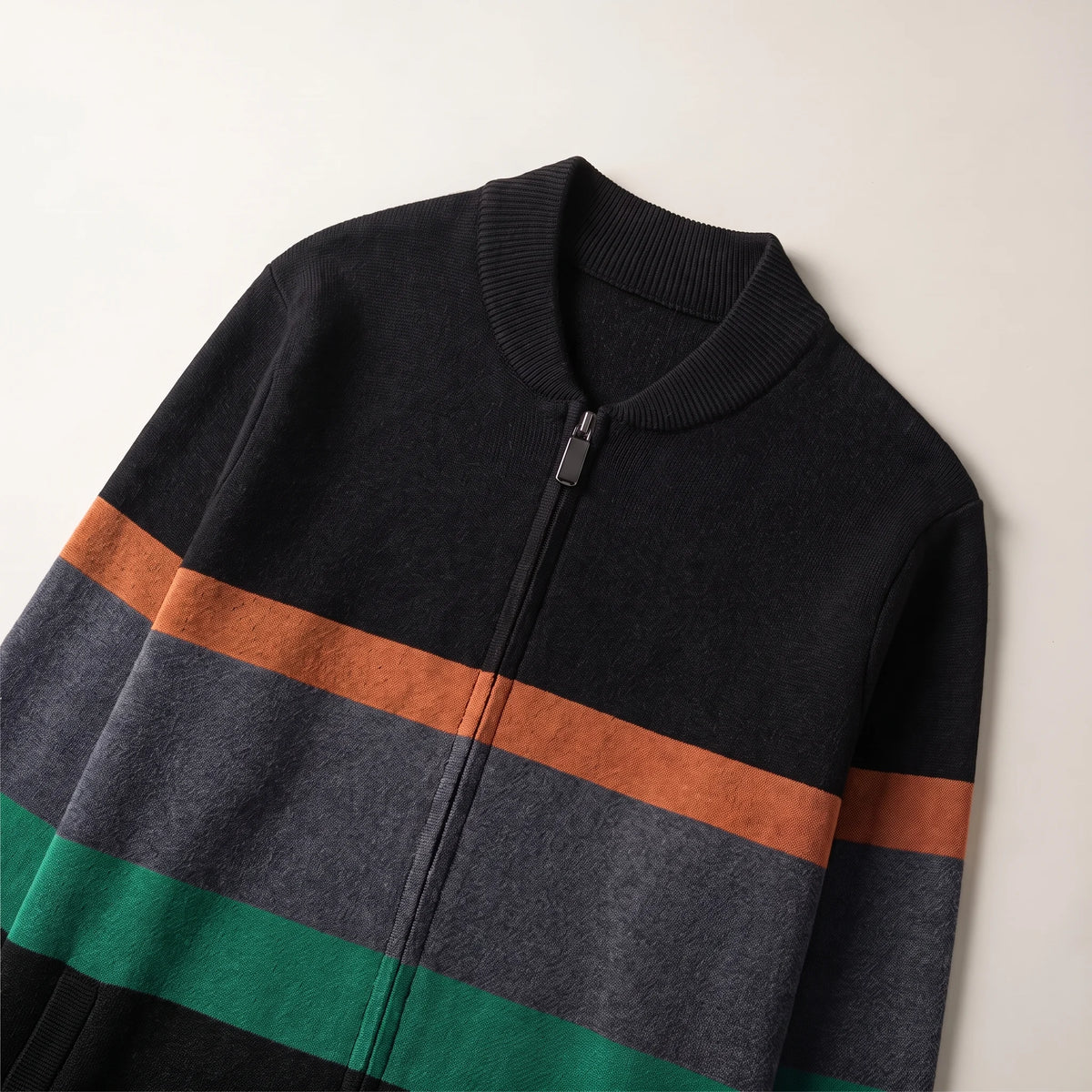 Close up of the ribbed baseball collar, metal zip and chest stripes on the block stripe cardigan