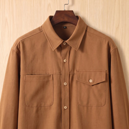 Close up of the collar and the two different chest pockets on the brown Boxy Cotton Overshirt