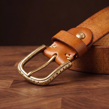 Close up of the antique brass pin buckle, keeper loop, rivet stud and ring wraps on the tan brass ring belt