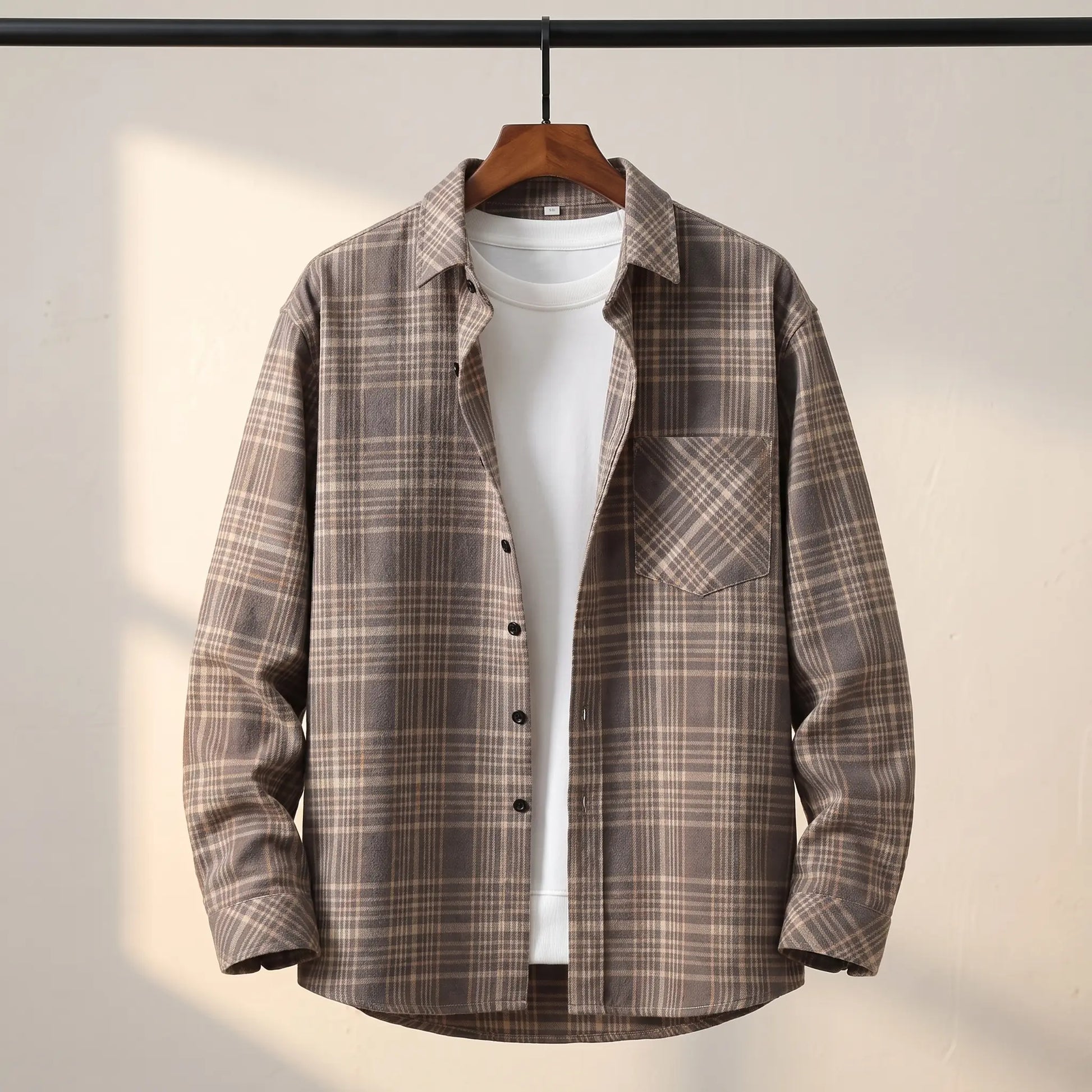 BRUSHED FLANNEL SHIRT in Gray - grey brown check flannel shirt with point collar and chest pocket on a wooden hanger