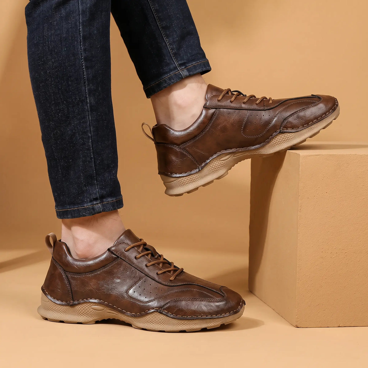 Burnished Casual Sneakers in Brown worn as a pair with dark jeans