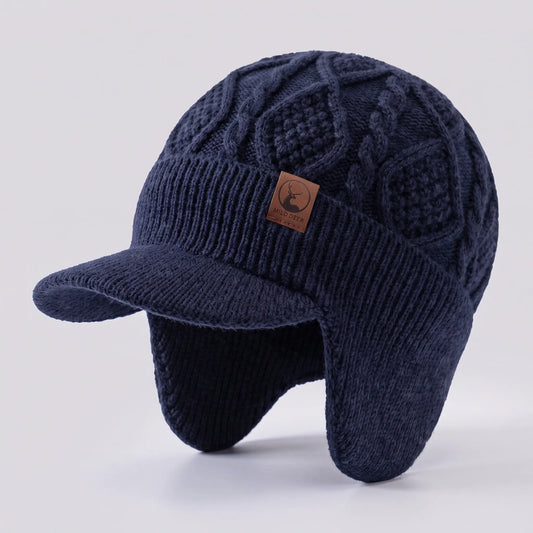 Men's navy blue cable-knit peaked earflap beanie with leather patch