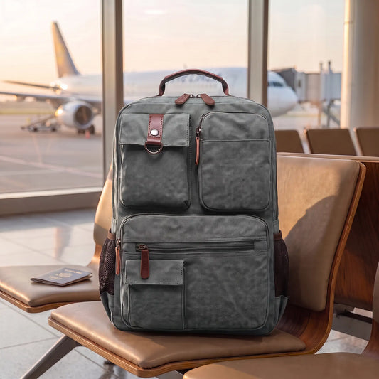 Canvas travel backpack in grey on an airport gate seat