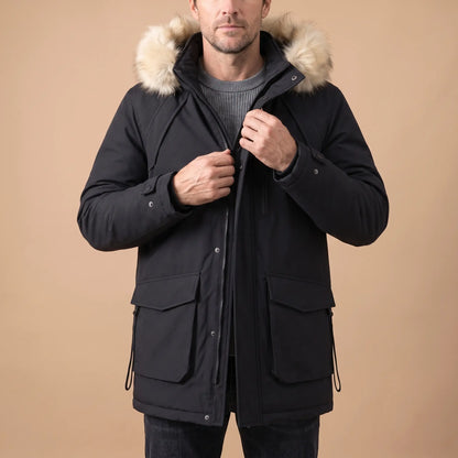 Man zipping up a black cargo pocket parka over a grey knit