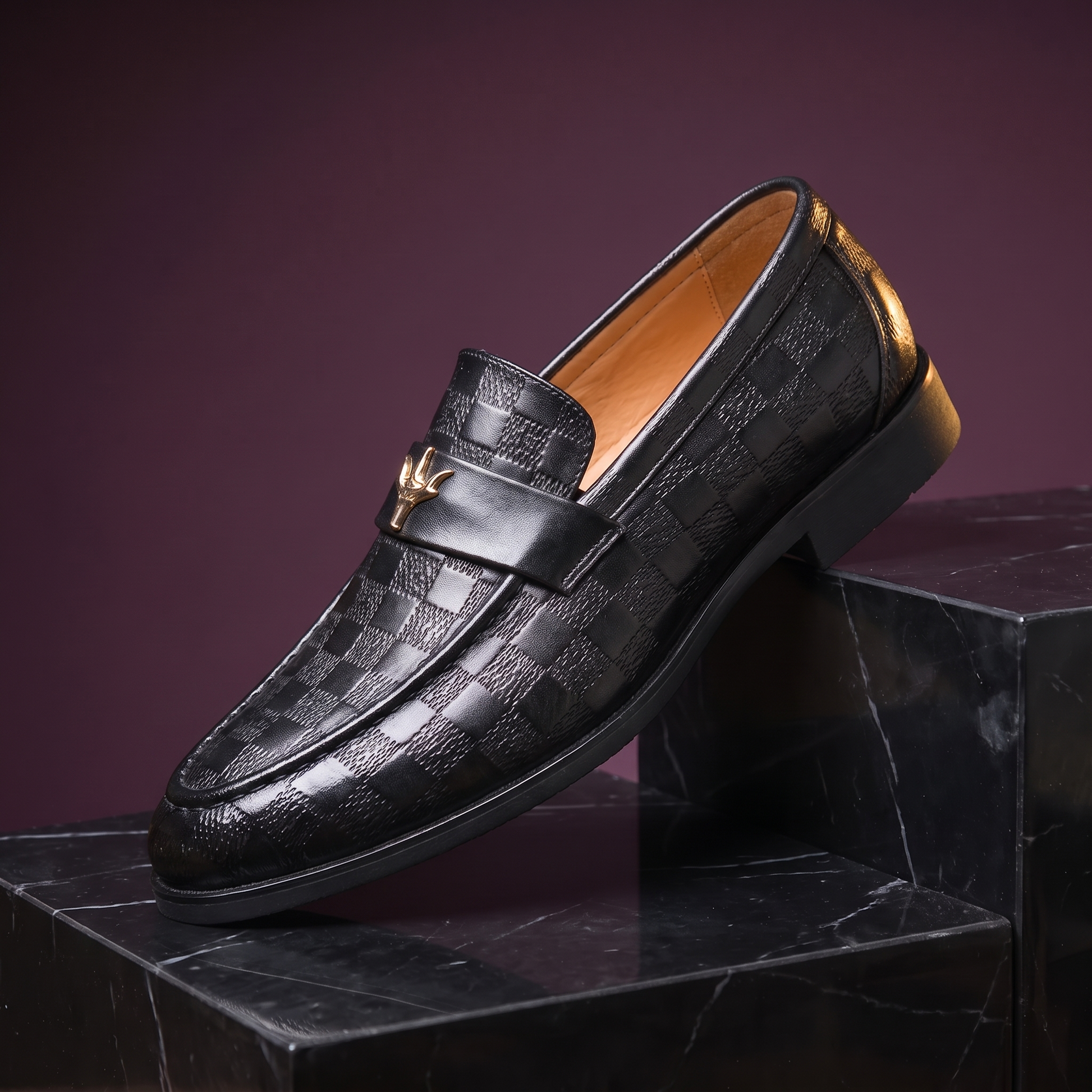 Black check embossed leather dress loafer with gold strap ornament