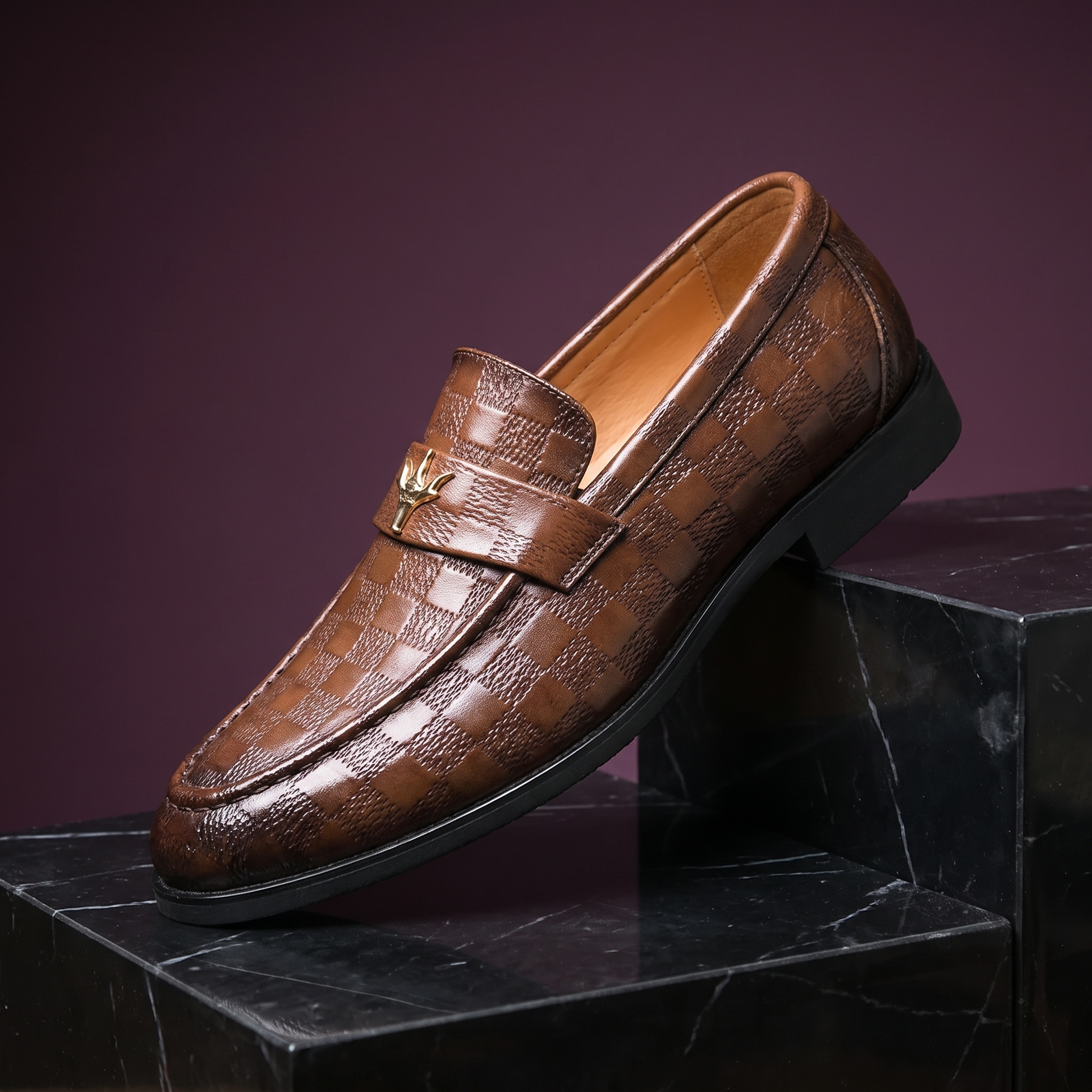 Brown check embossed leather dress loafer with gold strap ornament