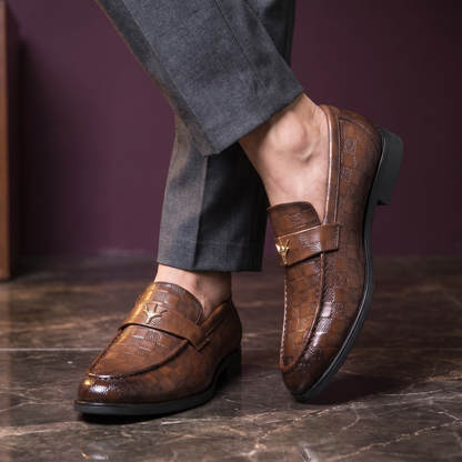 Man standing with ankles crossed wearing the check embossed dress loafers